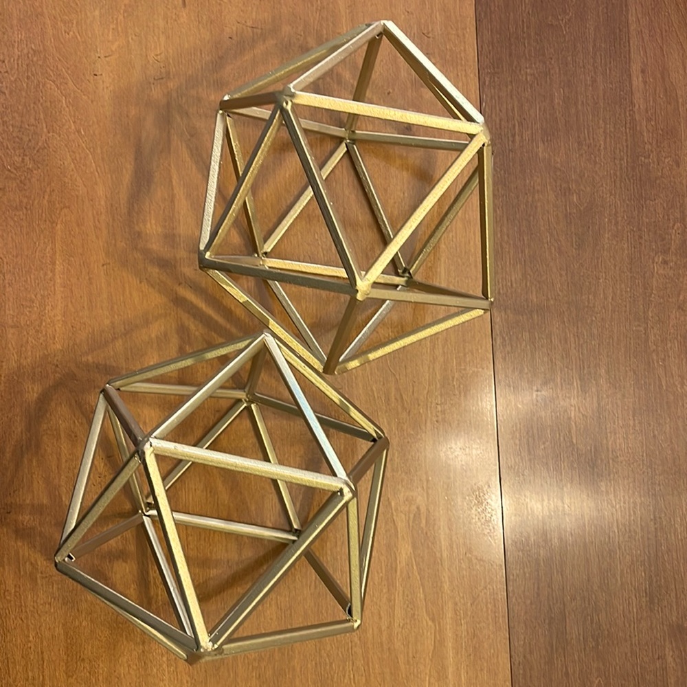 Set of TWO (2) decorative hexagonal gold pieces.